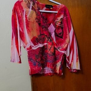 Printed faux wrap dolman sleeved semi cropped top with elastic at bottom sheer